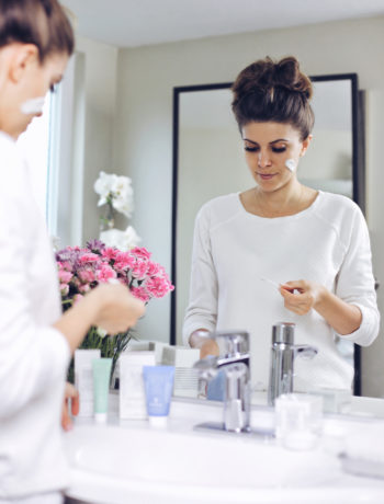 Fashion and lifestyle blogger Adelina Perrin of The Charming Olive using Sisley-Paris as a daily beauty routine