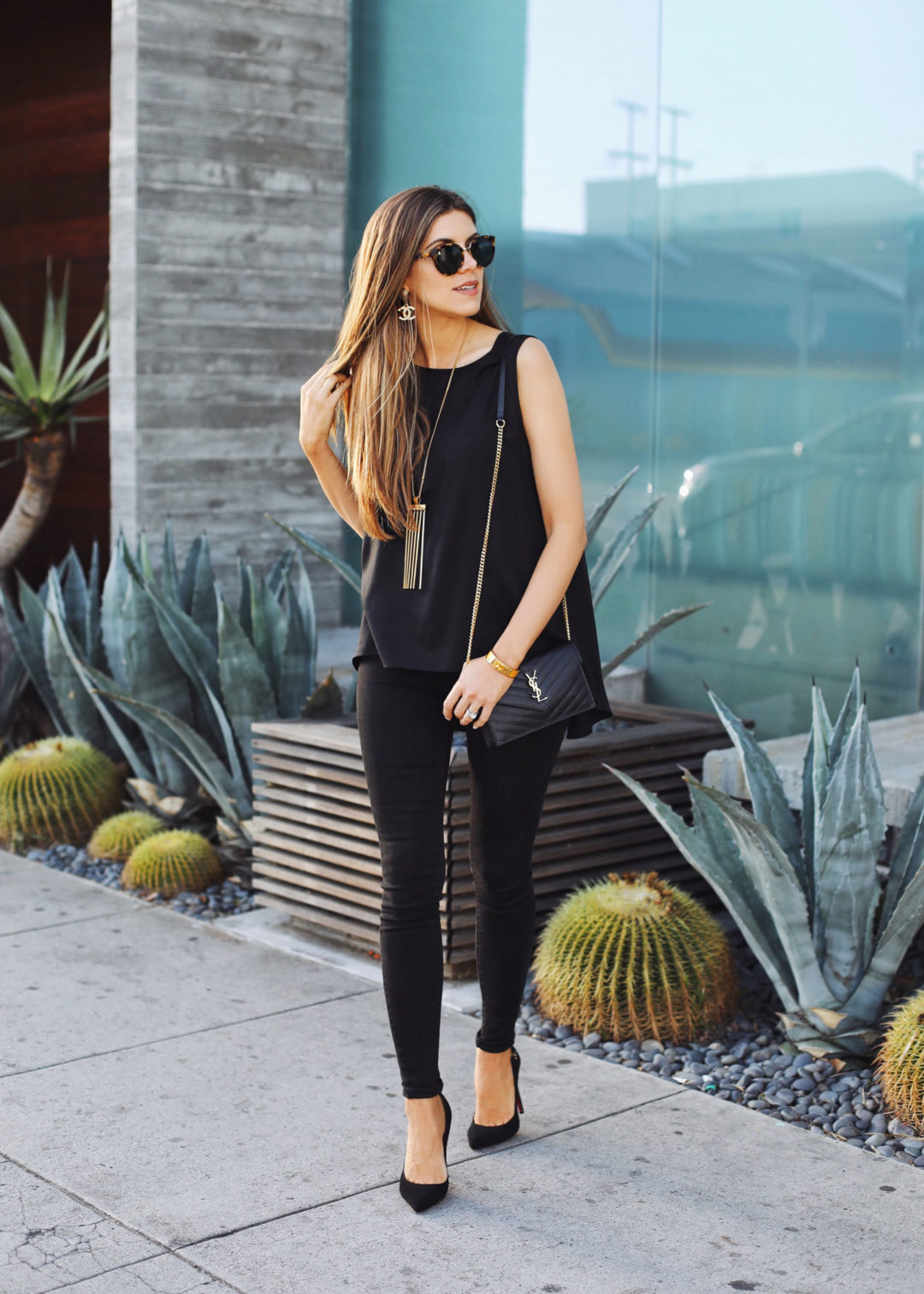 Fashion and lifestyle blogger Adelina Perrin of The Charming Olive wearing Switch Jewelry, Mott & Bow Jeans, Stitchfix top and YSL bag