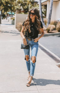 Fashion & lifestyle blogger Adelina Perrin of The Charming Olive wearing Levis Jeans, Gucci Belt, Stuart Weitzman heels.