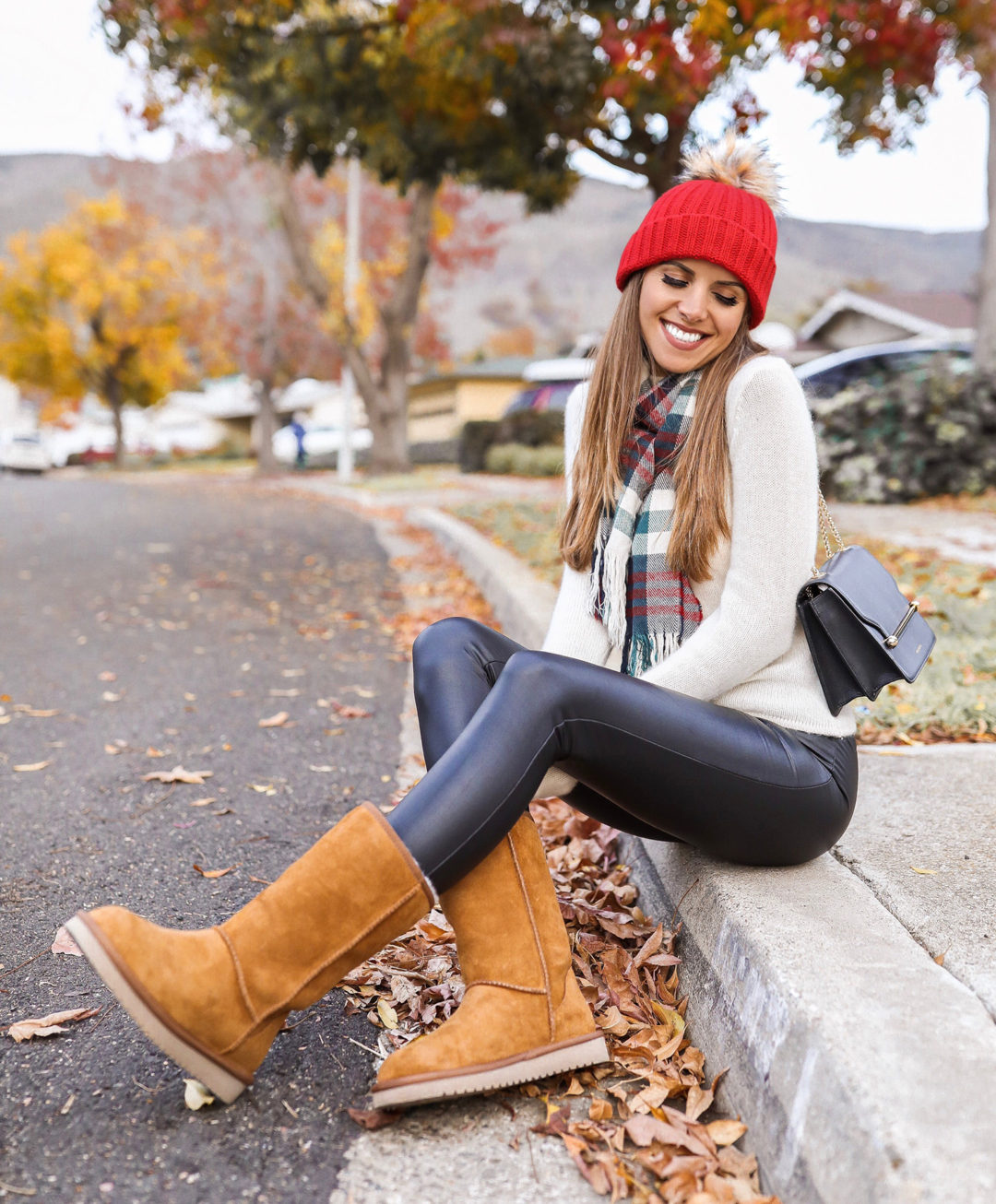Fashion Blogger Adelina Perrin of The Charming Olive wearing Koolaburra Winter Boots