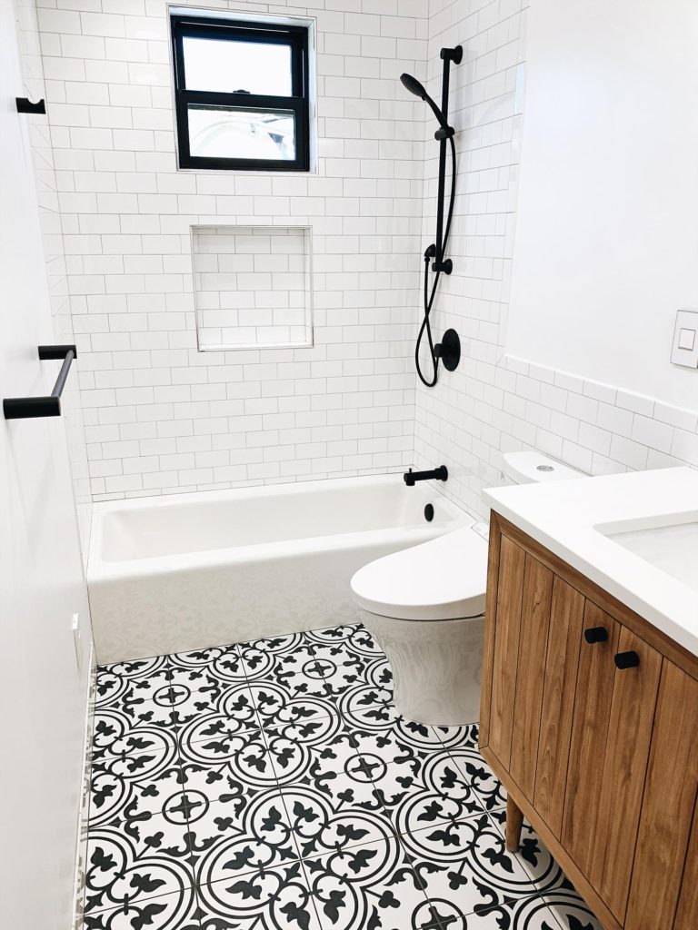 Adelina Perrin of The Charming Olive Wayfair After guest bathroom tile tub